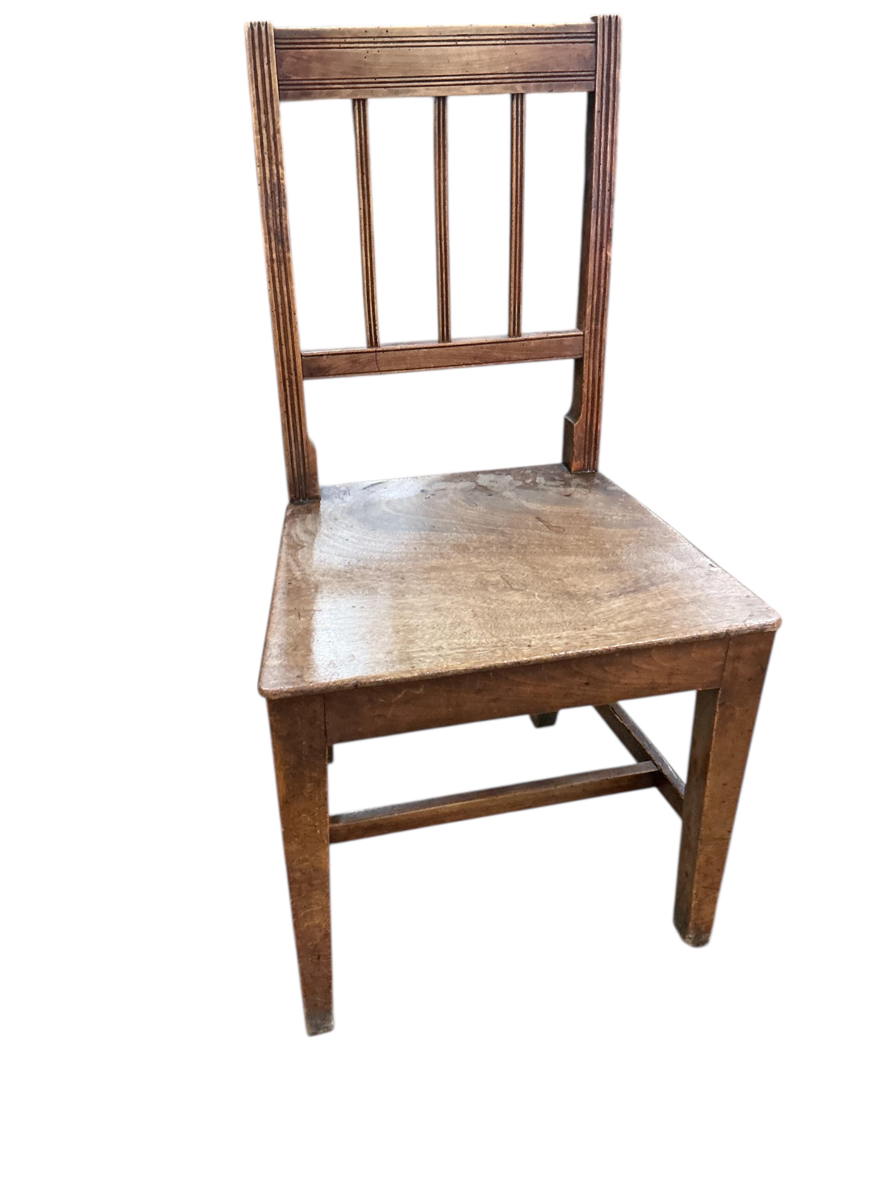 A set of six George III Provincial fruitwood and mahogany dining chairs